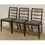 McIntosh, a set of three mid century teak dining chairs, with ladder backs, upholstered seat pads