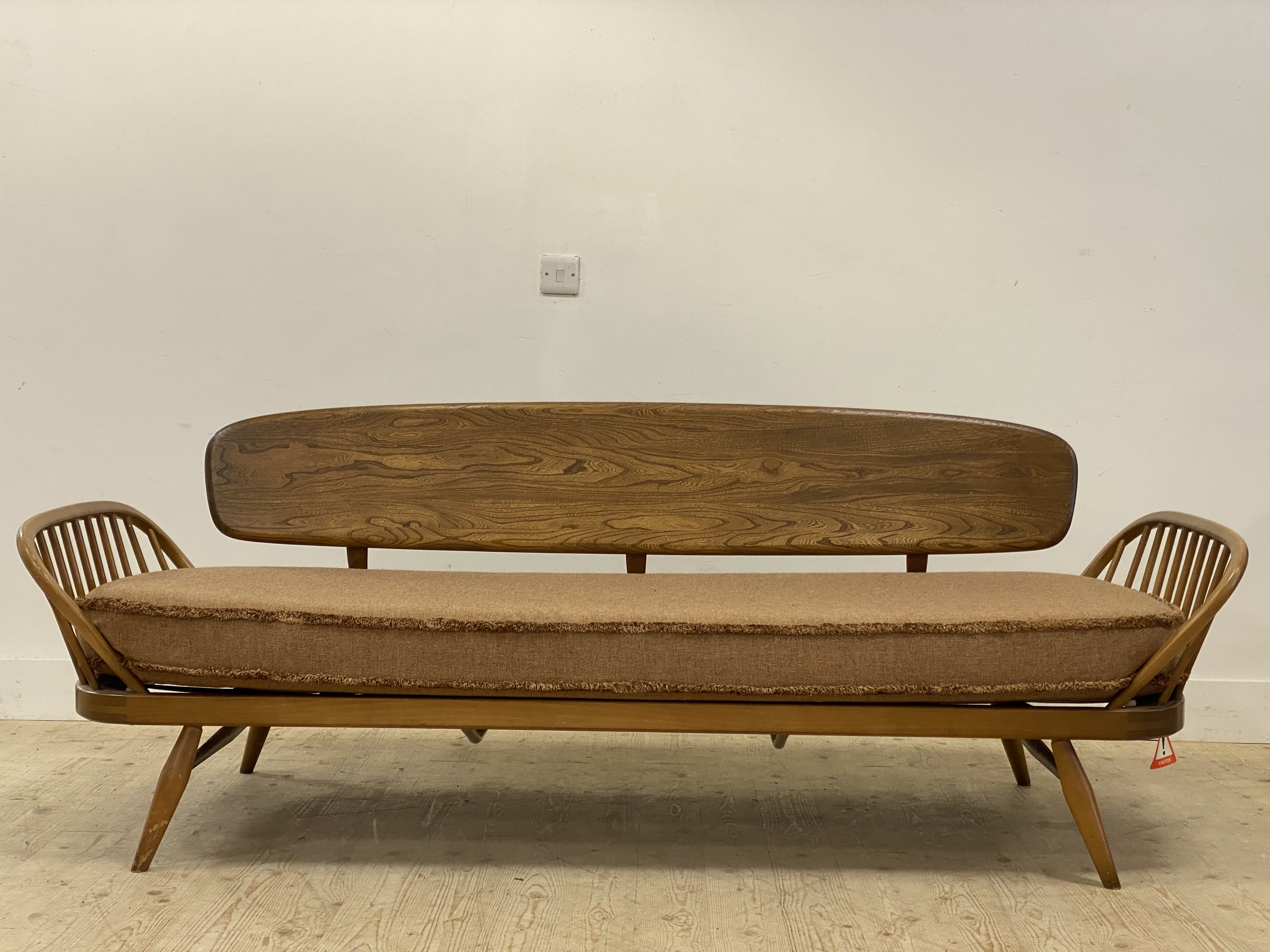 Ecol, a light elm and beech 'Surfboard' sofa, panel back above hoop and spindle arms, the squab - Image 3 of 5