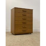 Schreiber, a mid century teak veneered chest fitted with six drawers. H96cm, W76cm, D46cm.