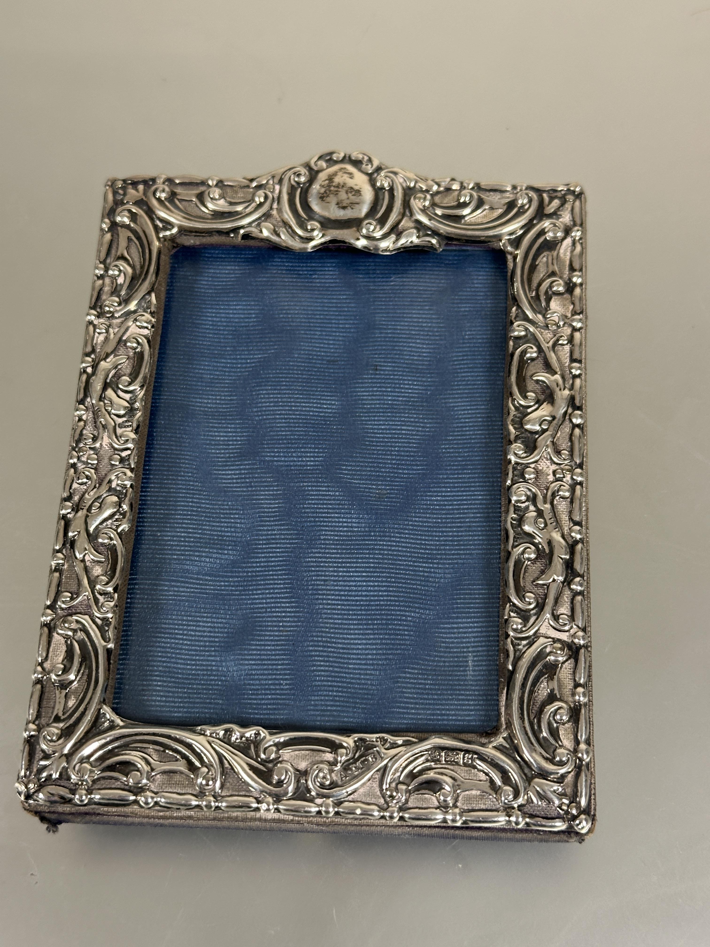 A Edwardian silver chased photograph frame of rectangular form with allover C scroll design - Image 3 of 4