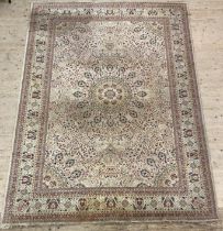 A Persian style Belgian rug, early to mid 20th century, the ivory field with floral arabesques and