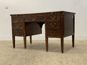 An Edwardian mahogany writing desk, the top inset with tooled blue leather writing surface, above