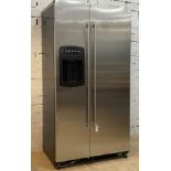 An Amercian style two door fridge freezer with stainless steel front, and ice / water dispenser.