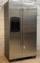 An Amercian style two door fridge freezer with stainless steel front, and ice / water dispenser.