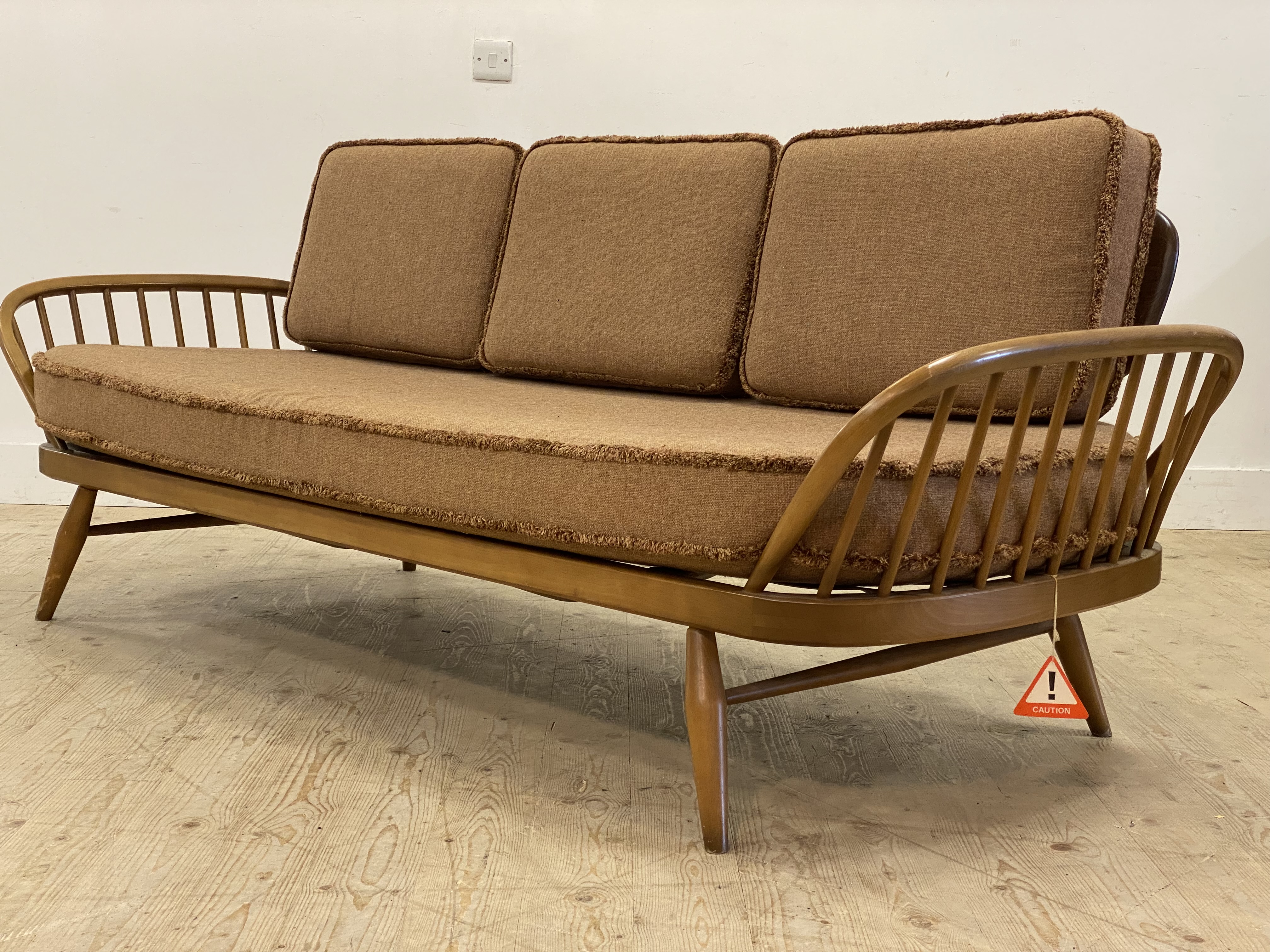 Ecol, a light elm and beech 'Surfboard' sofa, panel back above hoop and spindle arms, the squab - Image 2 of 5