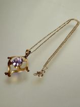 A Edwardian 9ct gold openwork Art Nouveau style pendant set oval faceted amethyst approximately