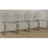A set of four contemporary dining chairs, clear moulded acrylic seats raised on chromed tubular
