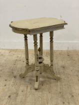 An early 20th century painted hardwood end table, the shaped top on cluster columns and four