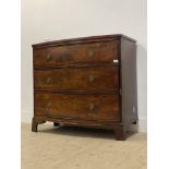 A 19th century mahogany bow front chest of three drawers, raised on bracket supports (two supports