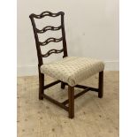 An Edwardian mahogany framed ribbon back chair with upholstered seat pad and raised on square