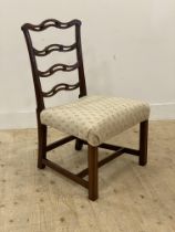 An Edwardian mahogany framed ribbon back chair with upholstered seat pad and raised on square