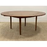Dyrlund, a Danish teak mid century extending dining table, the top with four segmented and fold over