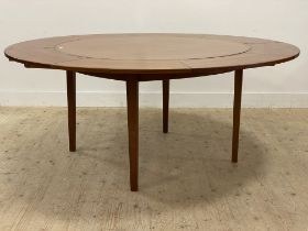 Dyrlund, a Danish teak mid century extending dining table, the top with four segmented and fold over