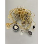 A collection of nine  gilt metal chain necklaces with paste pearl,paste and cz mounted oval pendant,
