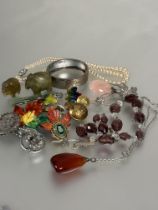 A collection of costume jewellery to include a amethyst glass oval faceted bead and clear crystal