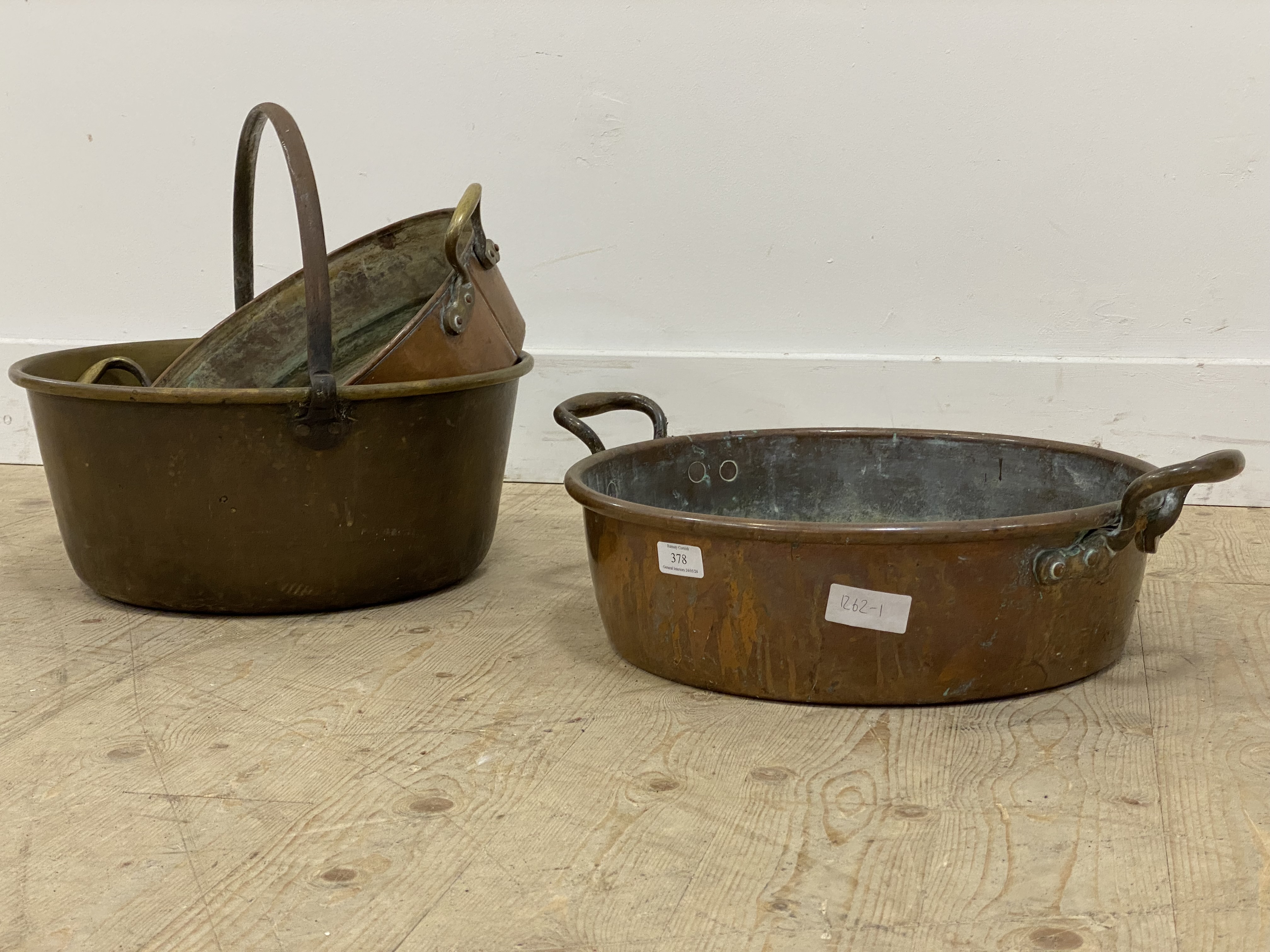 A set of three brass and copper preserve pans, 19th century. largest W43cm. .