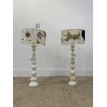 A pair of white painted bobbin turned lamp bases. H68cm.