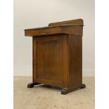 An early 20th century stained mahogany clerks desk / davenport, with ledge back above a writing