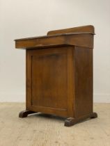 An early 20th century stained mahogany clerks desk / davenport, with ledge back above a writing