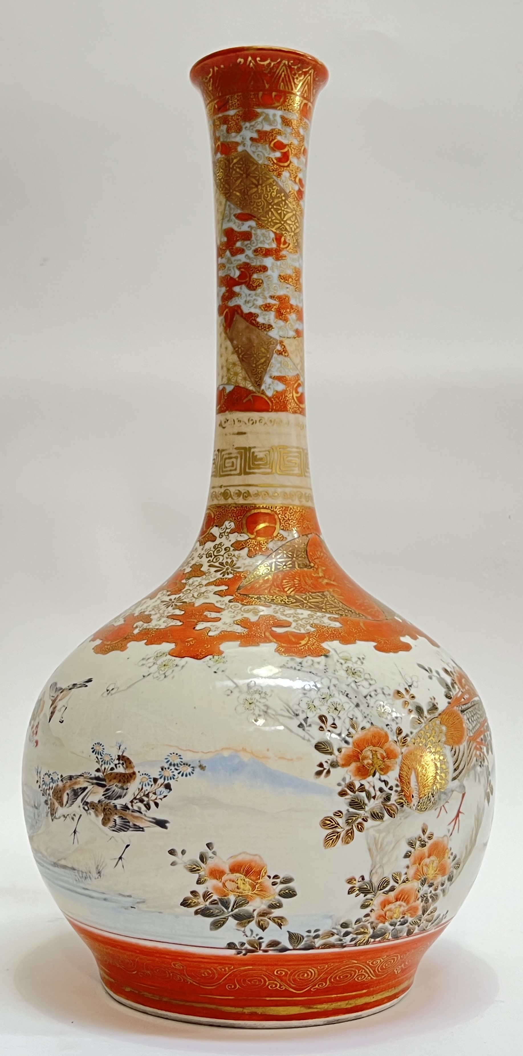 A Meiji period Japanese Kutani vase decorated with coastal scenes and pheasants in polychrome