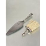 A Edwardian Birmingham silver table crumb brush with original hair bristles and rococo style
