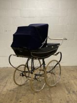 A vintage 'Marmet' coach built pram with sprung chassis and spoked wheels, chrome makers badge