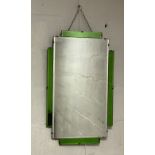 An Art Deco period sectional and bevelled wall mirror with green glass panels. 75cm x 46cm.