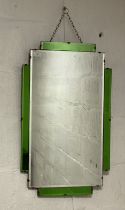 An Art Deco period sectional and bevelled wall mirror with green glass panels. 75cm x 46cm.