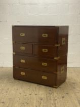 A two part brass bound mahogany campaign style chest, 20th century, the pull out writing drawer with