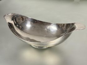 A Birmingham silver navette shaped bread or fruit dish with out swept tapered ends on circular