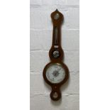 A late Victorian barometer and thermometer in a mahogany banjo pattern case, with silvered registers