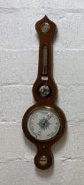 A late Victorian barometer and thermometer in a mahogany banjo pattern case, with silvered registers