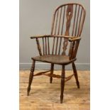 An elm and ash Windsor elbow chair, 19th century and later, the double hoop and spindle back above a