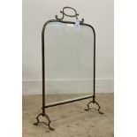 An early 20th century cast brass fire screen with bevel glazed panel. H70cm.
