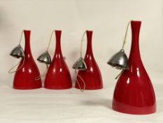 A set of four mid century / vintage red glass pendent light fittings, in the manner of Holmegaard.