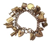 9ct gold charm bracelet with various 9ct gold charms including a Victorian gold half sovereign, 1899