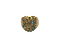 Yellow metal bombé ring set with turquoise stones