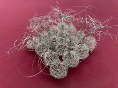 Contemporary wire work sculpture formed as sixteen plant bulbs, 22cm sqaure
