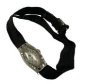 1920s Art Deco cocktail wristwatch in diamond and sapphire set case, on black fabric adjustable stra