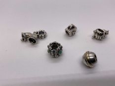 Five Pandora silver charms