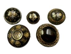 Group of five 19th century tortoishell piqué work brooches with floral decoration. 20-31mm diameter