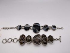 Two silver bracelets, one with polished ammonite fossil, smokey quartz and shells, 21cm, the other b