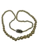Cultured pearl necklace formed as a string of graduated pearls with white metal clasp