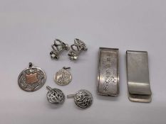 Two silver money clips, two pairs of silver cufflinks and two silver fobs