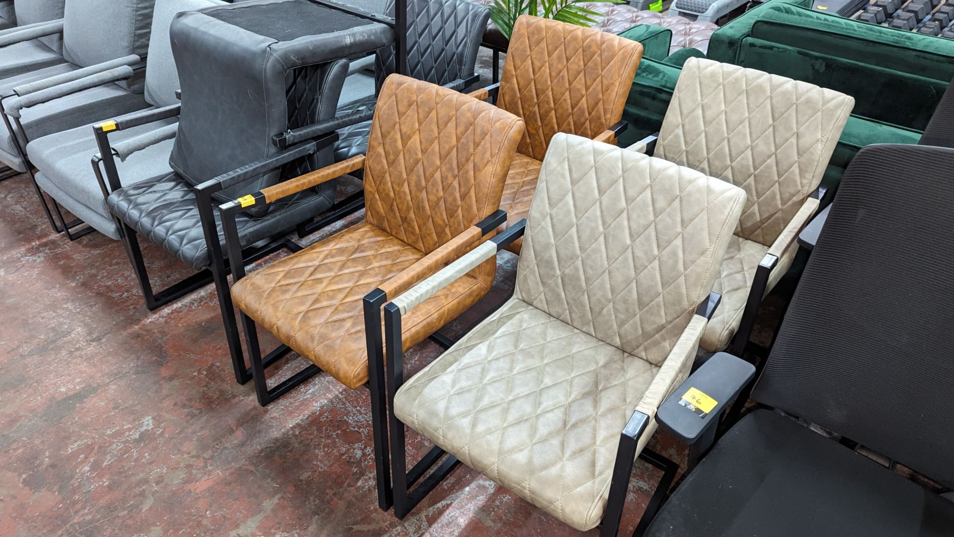 4 off chairs on the same black metal frame, 2 upholstered in tan colour pleather fabric with diamond