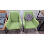 2 off green upholstered fabric chairs on black metal frames, one of which includes a grey scatter cu