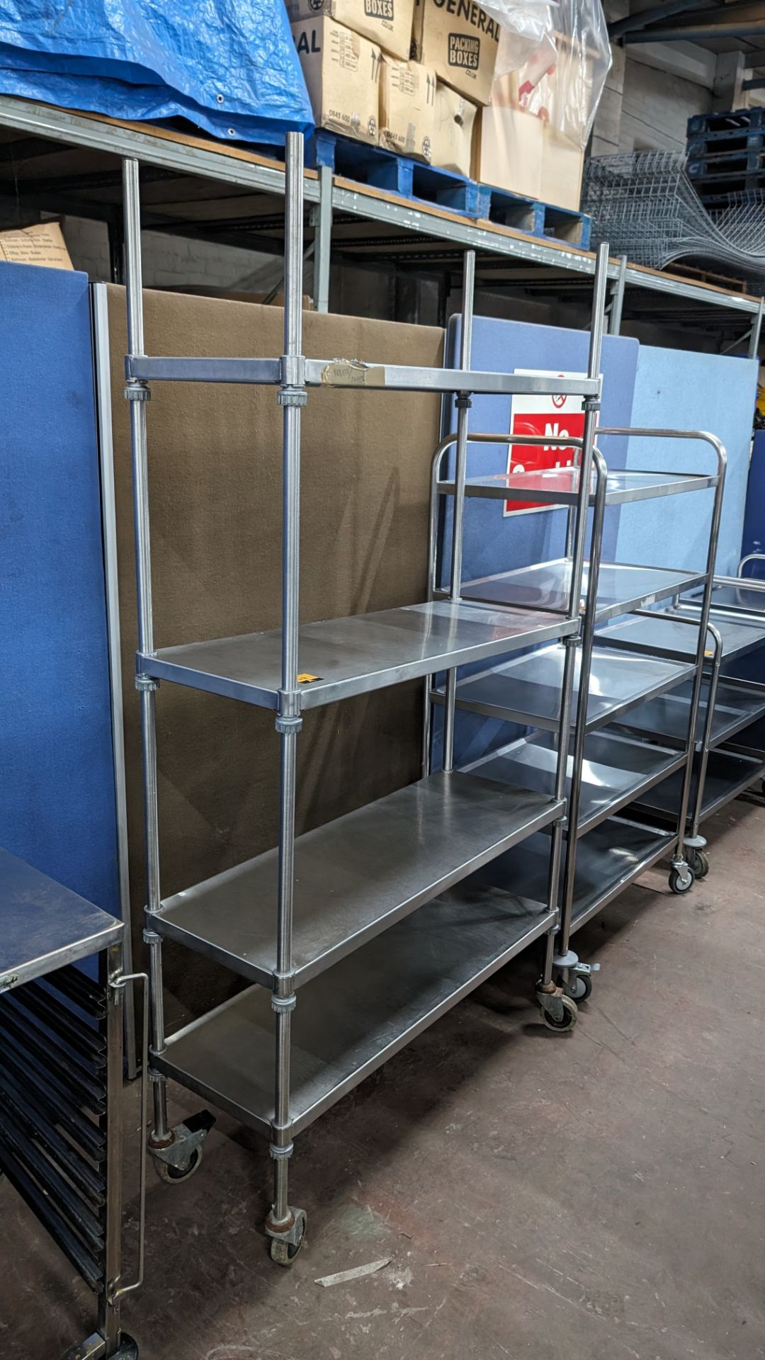 Stainless steel mobile shelving unit with a total of 4 shelves, max external dimensions approximatel