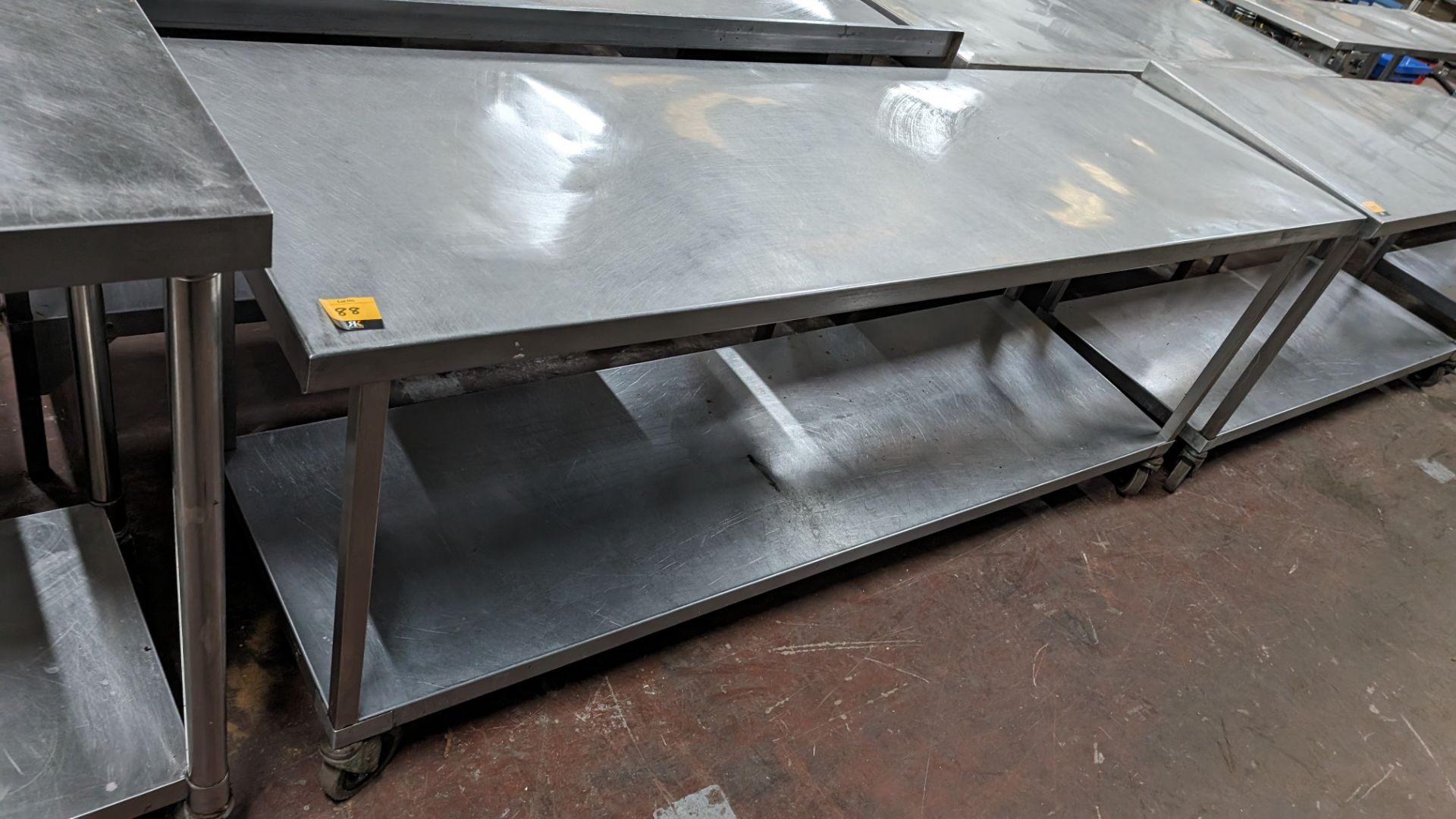 Stainless steel large mobile twin tier table, max dimensions 2100 x 640mm x 860mm