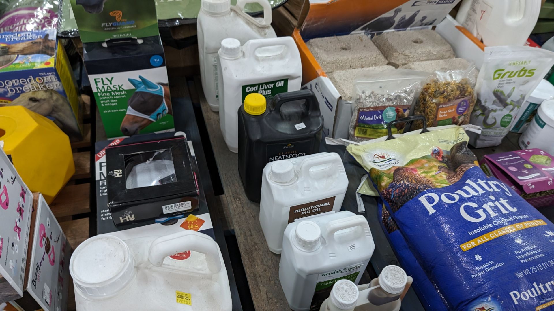 The contents of a pallet of animal related items including horse mesh masks, assorted oils, poultry - Image 4 of 10