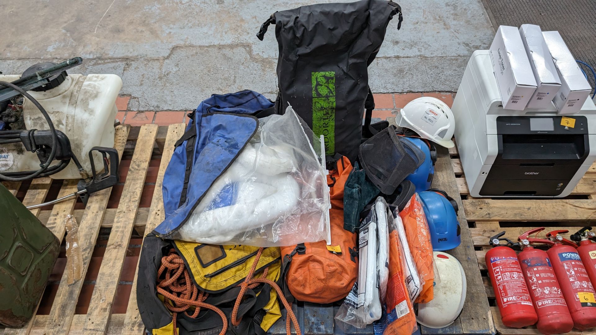 The contents of a pallet of assorted safety equipment, PPE, spill kits & more